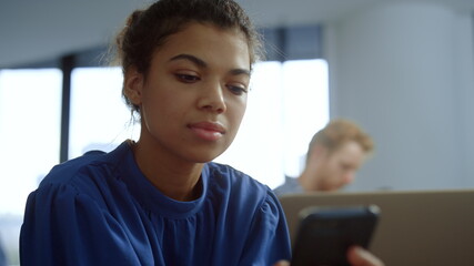 Businesswoman using mobile phone. Manager browsing internet on smartphone