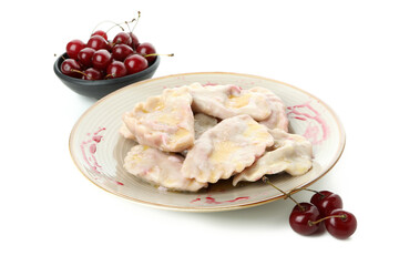 Plate with pierogi with cherry isolated on white background