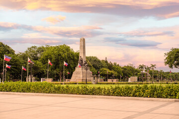 Manila, Philippines - Rizal Monument in Luneta (Rizal Park), in the afternoon. Built to commemorate the executed Filipino nationalist, José Rizal. - obrazy, fototapety, plakaty