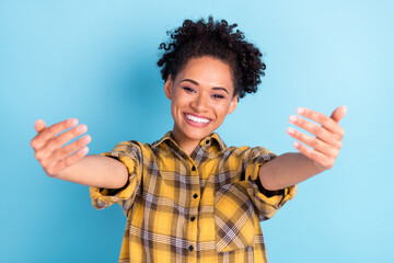 Photo of young cheerful african girl happy positive smile show hands come welcome sign isolated over blue color background - obrazy, fototapety, plakaty