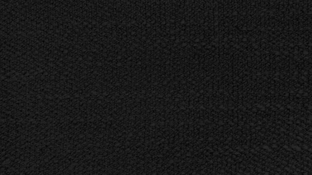 close up black cloth texture background showing fiber detail. dark black sackcloth surface. woven thread background.