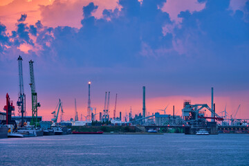 Fototapeta premium Port of Antwerp with harbor cranes in twilight