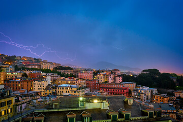 Evening view of Genoa Genova town in thunderstorm with lighting. Genoa, Italy