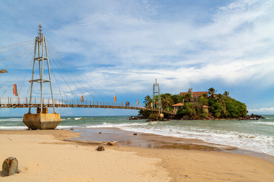 Buddhist temple on Parey Dewa island with the bridge to the temple in Matara, Sri Lanka