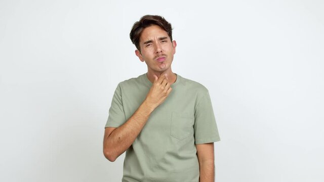 Young man with sore throat over isolated background