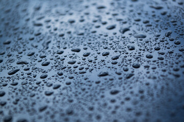 Raindrops on blue background. Wallpaper, background, texture.