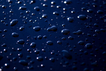 Raindrops on navy blue background. Wallpaper, background, texture.