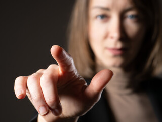 The woman touches an imaginary screen with her finger. The girl presses a button on the screen. A...