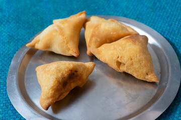 Homemade Samosa, samsa or smosa. A vegetarian spicy Indian special traditional street food. Iftaari dish, Selective focus.
