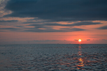 Sunset and surf on the beach in Loo, Russia, Krasnodar Territory