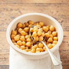 Cooked Chickpeas on a bowl wooden rustic background. copy Space, selective focus. Nutrition, Healthy, vegetarian food concept.