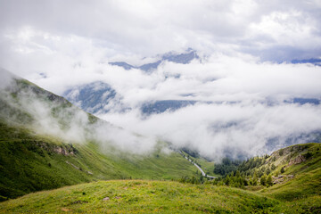 Fototapeta na wymiar Low clouds over Grossglockner High Alpine Road in Austria - travel photography