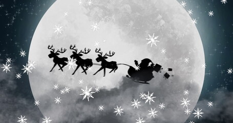 Obraz premium Image of black silhouette on santa claus in sleigh being pulled by reindeer with winter scenery 