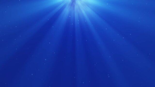 Rays of blue lights from the sky on the blue background. 4K motion footage.