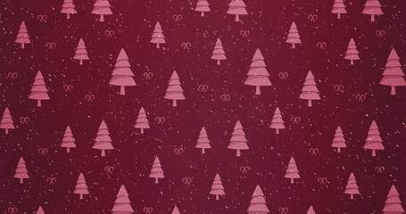 Image of snow falling against christmas tree pattern on red