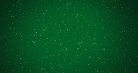 Image of winter scenery with snow falling on green background