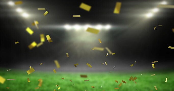 Image of golden confetti falling over empty sports stadium