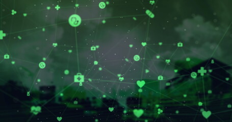 Globe of digital icons against cityscape