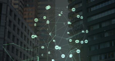 Globe of digital icons against tall buildings