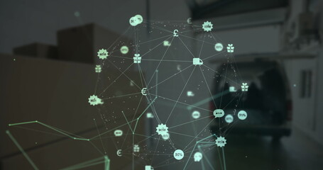 Globe of digital icons against cardboard boxes in garage