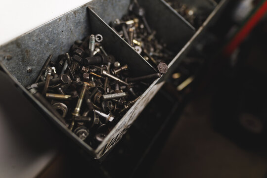 Close up of containers full of screws and nuts