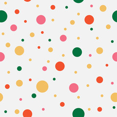Colorful chaotic dots. Yellow, green, pink, orange circles on light background. Vector seamless pattern. Bright abstract texture for your design, paper, textile