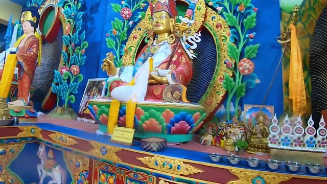 buddhist god statue close up shot at monastery from different perspective