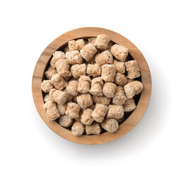 Top view of oats bran pellets in wooden bowl