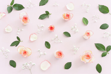 Pastel delicate background with pink roses and petals. Top view