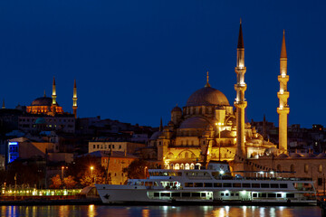 Fototapeta na wymiar Yeni Cami known as New Mosque in Istanbul with Nuruosmaniye Mosque in the background, Istanbul, Turkey