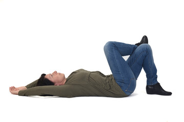 woman lying on the floor looking up and legs crossed on white background