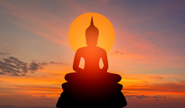 buddha silhouette on golden sunset background beliefs of Buddhism