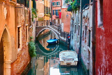 Canal with bridge and boats in Venice