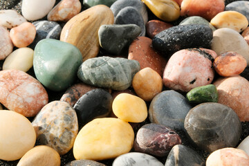 Sea wet stones, multicolored pebbles close-up. Background, texture for postcards, articles about the rest