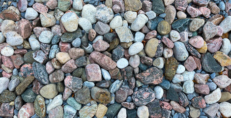 Rough river rocks background in soft colours 