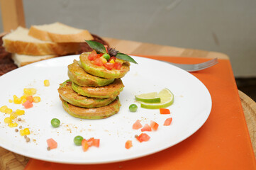 Vegetable fritters of zucchini on a plate