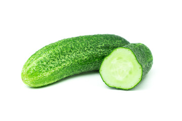 Whole and half cut fresh prickly cucumbers isolated on white background. Green vitamin vegetables.