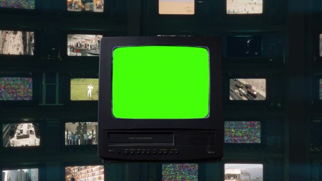 Old TV Green Screen Vintage Television Channels Background. Old tv green screen in front of many televisions with vintage movies in the background