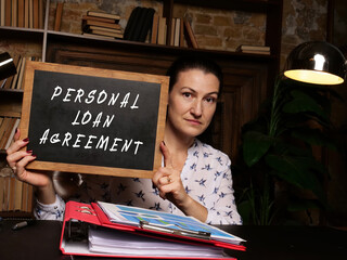 Financial concept meaning PERSONAL LOAN AGREEMENT with phrase on the chalkboard
