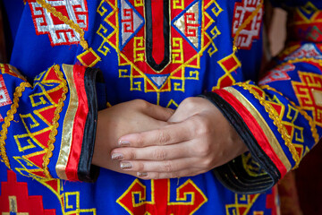 Details of motifs on the colorful traditional wedding dress in Nukus, Uzbekistan