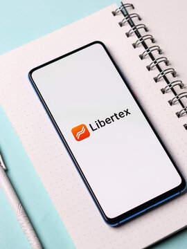 Assam, india - February 19, 2021 : Libertex logo on phone screen stock image.
