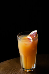 citrus alcoholic cocktail in a glass glass