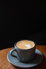 blue ceramic mug with cappuccino