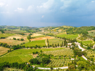 Fototapeta na wymiar Siena, Italy - aerial panorama of the valleys and towns of the Crete Senesi in Tuscany