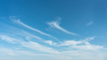 White clouds and blue sky and moon suitable for background
