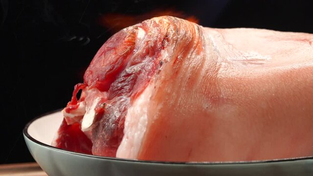 Raw pork knuckle with fresh meat ingredients