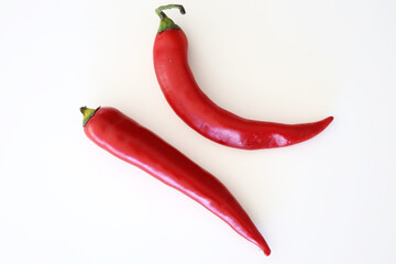 Two red chili peppers
