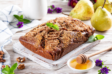 Homemade chocolate cake with pears on table