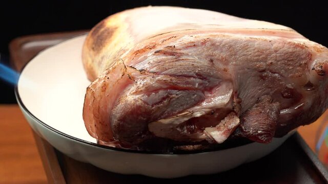 Raw pork knuckle with fresh meat ingredients