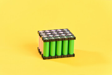 Lithium battery on yellow background.